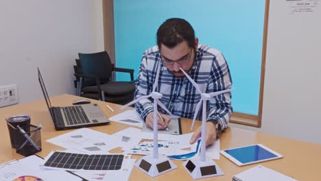 designer making corrections on a plan with a digital tablet