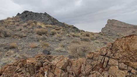 Silent-prairie-landscape-of-barren-mount,-stone-and-cliff