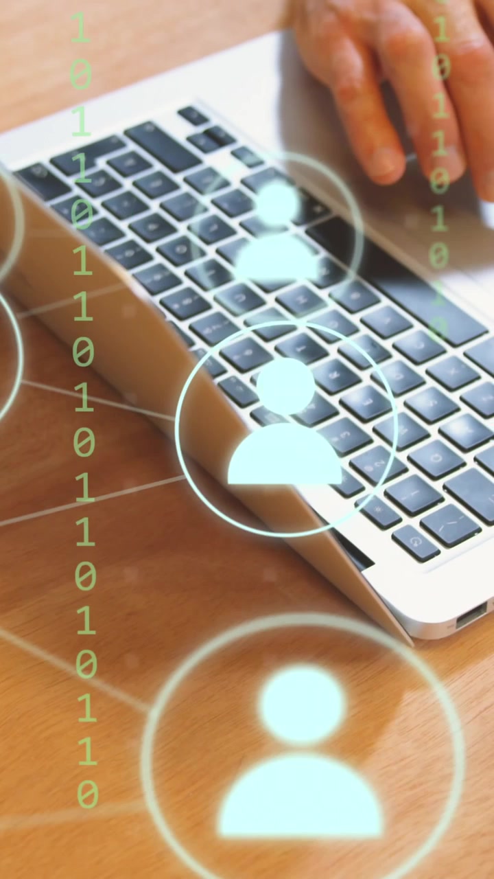 Animation of icons and data processing over man using laptop