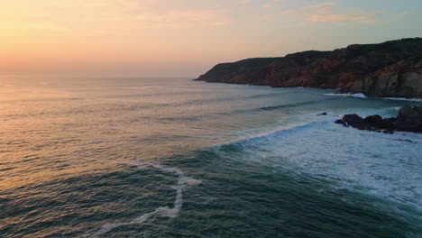ocean waves sunset beach nature. sea water splashing rough cliffs evening coast