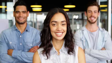 Portrait-of-happy-executives-standing-with-arms-crossed