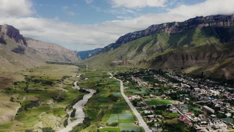 mountain valley landscape with river and village