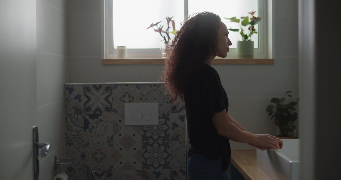 Emotional woman holding herself