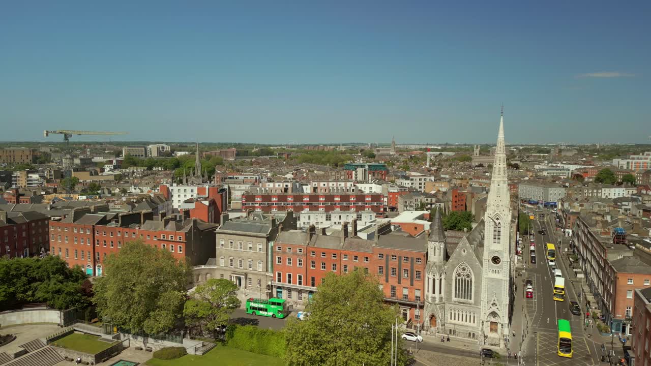 Wide reversing aerial video of Abbey Presbyterian Church and the surrounding area in Dublin City Centre, Ireland on a bright and sunny day. Filmed in 4K, 60FPS and with Rec709 color.