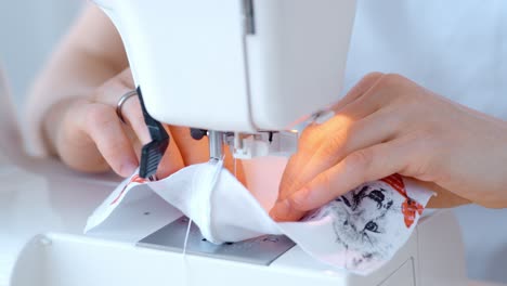 woman sewing with a sewing machine