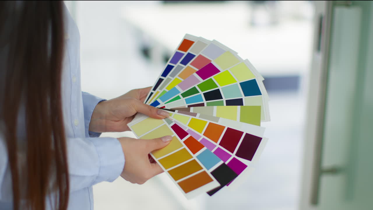 Woman holding color swatches