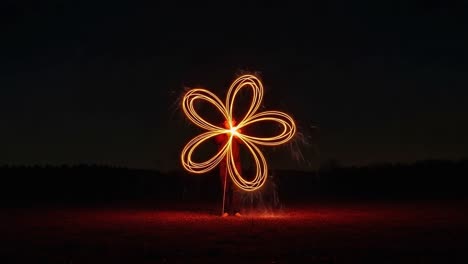 captivating light art: stunning firework flower design illuminates the night sky with vibrant sparkles and intricate patterns in a captured moment