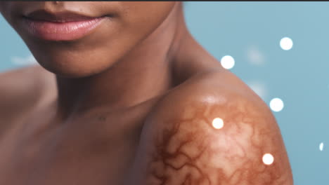 close-up of a woman's shoulder with a scar