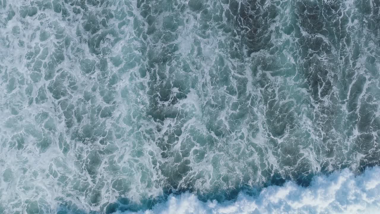 Top Down Slow Motion Drone shot of abstract wave motion and patterns in Uluwatu Bali Indonesia