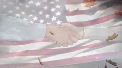 Animation-of-shaking-hands-and-leaves-over-flag-of-usa