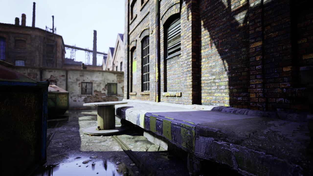 Abandoned industrial area with shadows and reflections on old structures