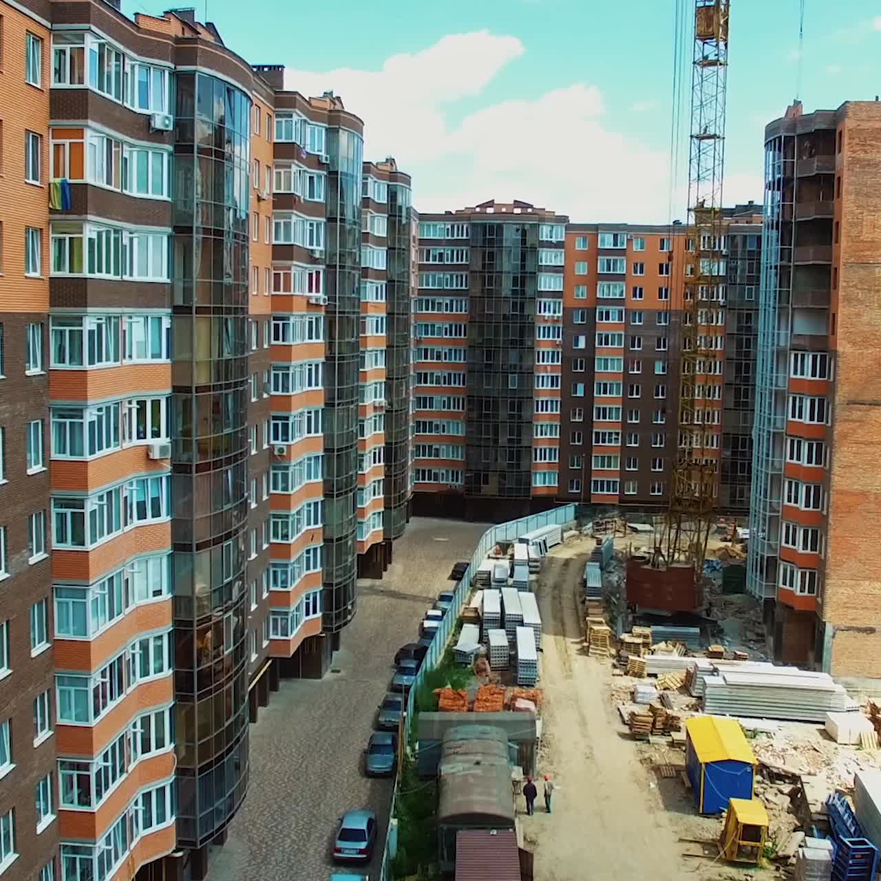 Construction site of a multi-storey building. New architecture builds in the modern residential complex of a city.
