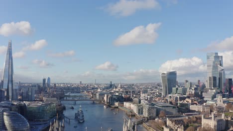 descending aerial drone shot of central london to tower bridge river thames