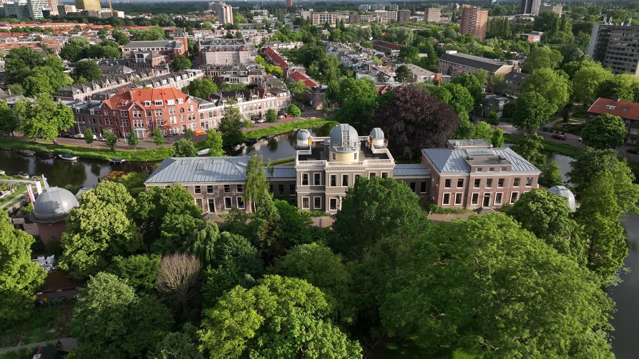 Aerial View of Building Surrounded by Trees in a City