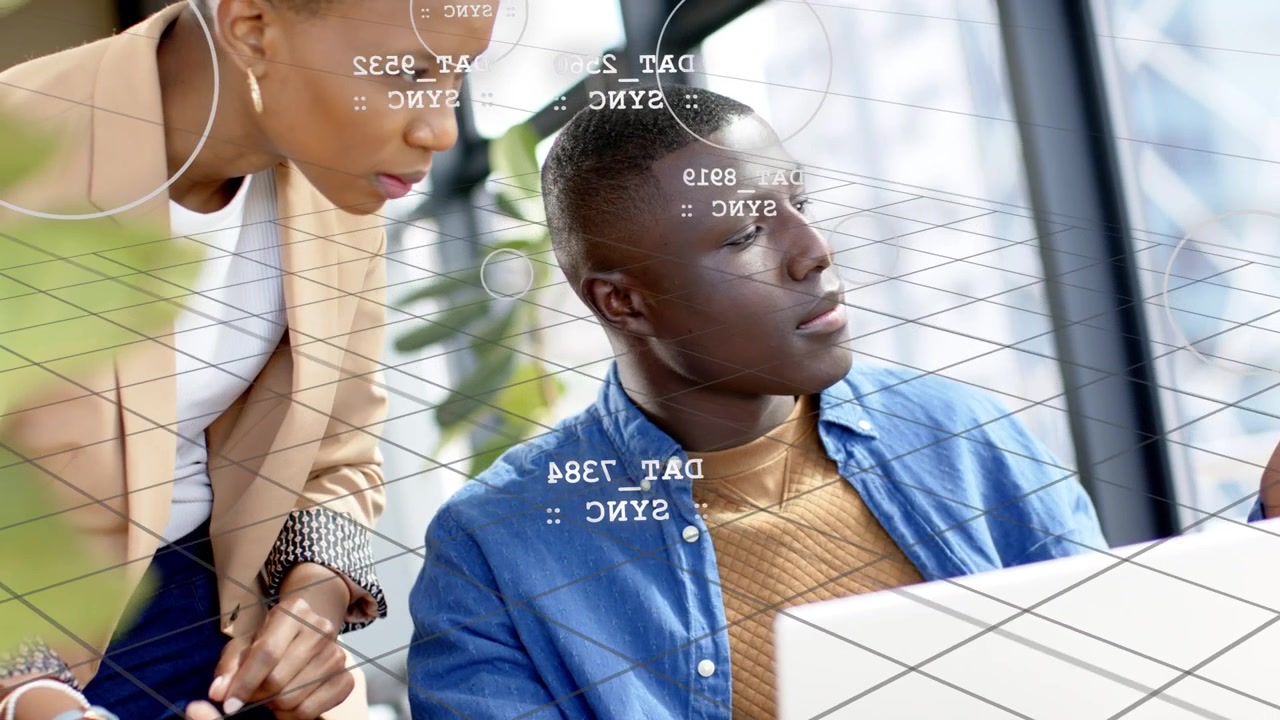 Woman leaning and pointing at laptop, initiating business data review with animated grid overlay