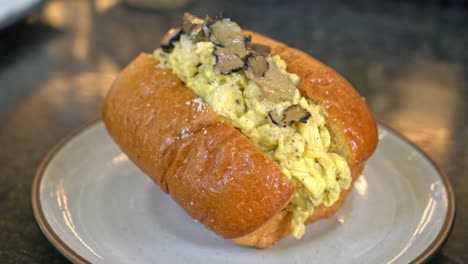 bun or bread with scrambled eggs and truffle mushroom