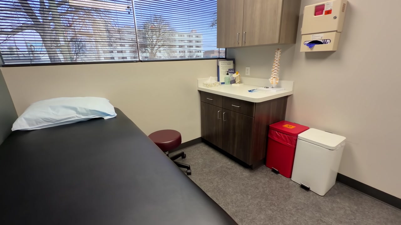Interior View Of A Medical Examination Room At A Spine Doctor's Office Clinic, Panning Shot.