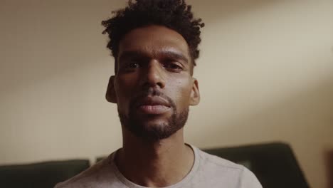 Close-up portrait of a serious man looking directly at the camera