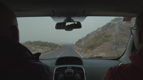 A-mountain-road-view-from-the-windshield-of-a-moving-car