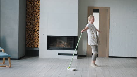 woman mopping in a modern living room