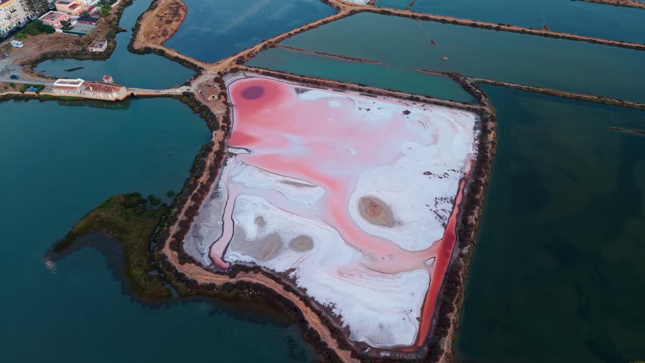 aerial shot around salt pans in Algarve region near Ria Formosa natural parc and Fuseta village, Portugal