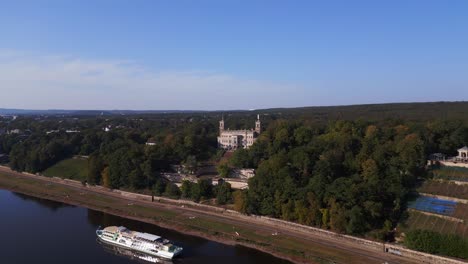 grand luxurious cruise ship  castle by tranquil river. best aerial top view flight wide orbit overview drone4k