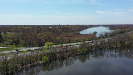 an aerial view of some reflective lakes during the day