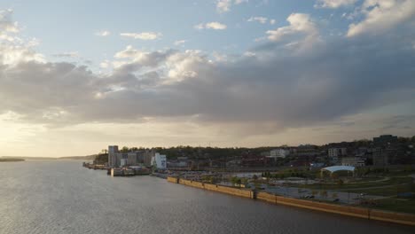 drone shot of alton illinois from across the mississippi river during sunset