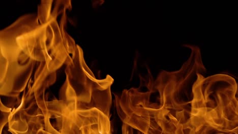 Flames-of-fire-on-black-background-in-slow-motion