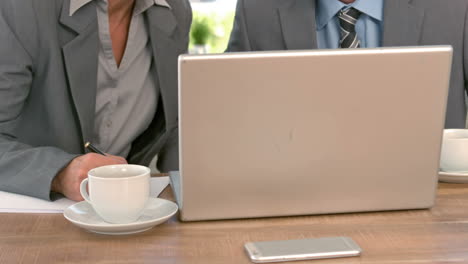 business workers looking at tablet computer