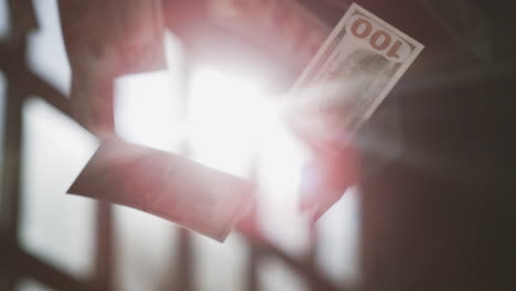 billetes de cien dólares voladores