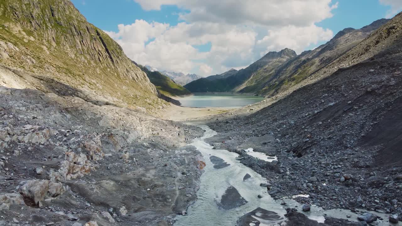 Swiss dam with a lake and a blue sky