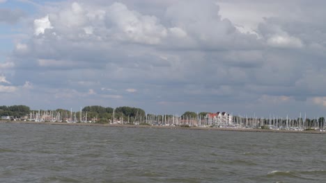 sailboats at marina on a cloudy day