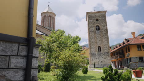 a low angle panning view over the pillars of the monastery of rača , situated in the vicinity of bajina bašta, a town in western serbia