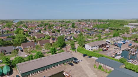 zooming out to reveal dutch suburban homes and quiet streets with abundant trees and gardens