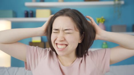 Close-up-portrait-of-Asian-woman-having-nervous-breakdown.