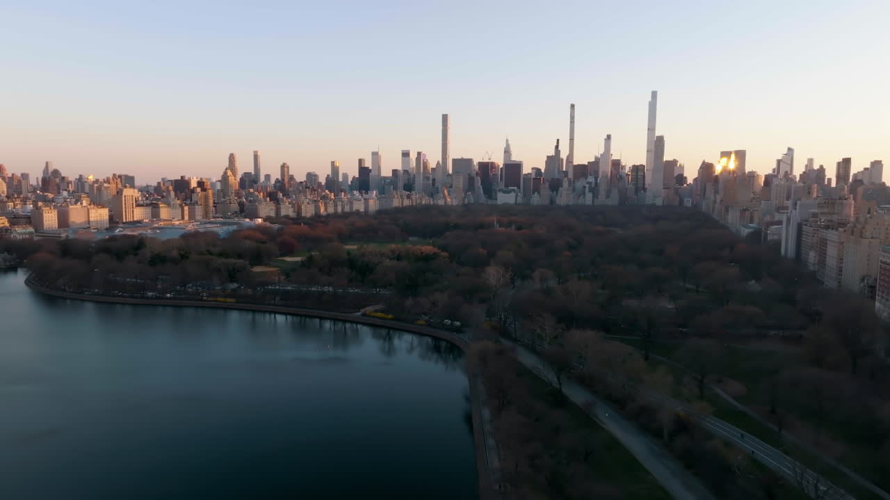 Establishing aerial view of the Central Park of Manhattan, golden hour, New York