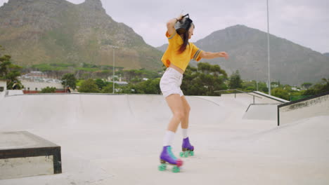 Female-roller-skater-with-a-boombox-dancing