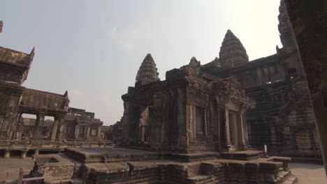 ruins of the ancient buddhist stone temple angkor wat, siem reap, cambodia.  light rays on sunny day