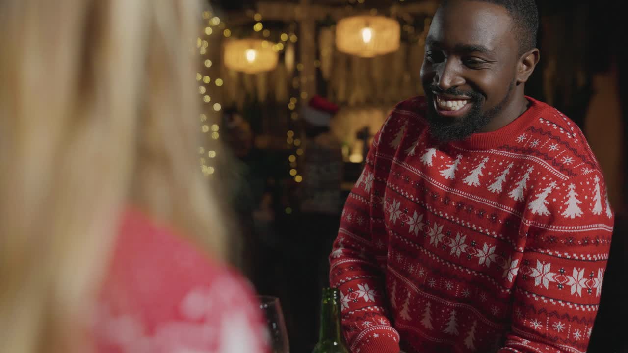 Tracking Shot Revealing Small Group of Friends Celebrating Christmas at a Bar