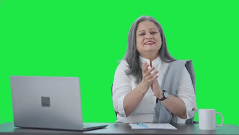 Happy-Indian-senior-businesswoman-clapping-and-appreciating-Green-screen