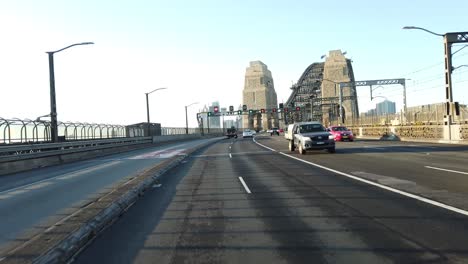 driving over the sydney harbour bridge during dawn