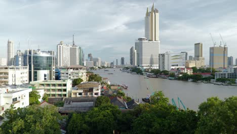 panoramic footage of downtown bangkok’s skyline during sunset, showcasing modern skyscrapers, high-rise buildings, and the vibrant urban landscape of thailand’s capital city