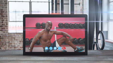 Animation-of-tablet-computer-showing-a-African-American-man-exercising.-Coronavirus--spreading