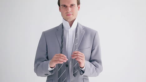 businessman adjusting his tie