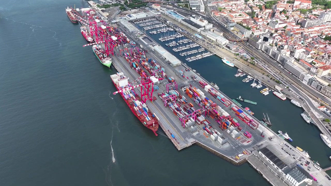 Experience a vibrant cargo port filled with colorful shipping containers and busy container ships. Watch as maritime logistics drive global trade and ensure timely delivery of goods.