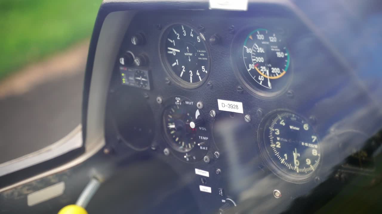black cockpit of a glider airplane with different display fittings