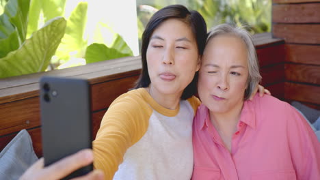 taking selfie, women smiling and making funny faces, enjoying time together