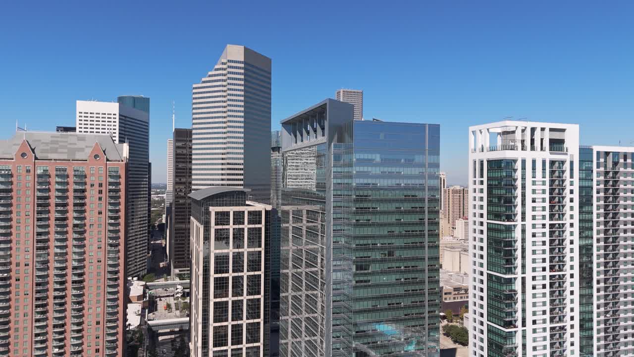 Houston Texas skyscrapers, daytime blue sky aerial drone establishing shot