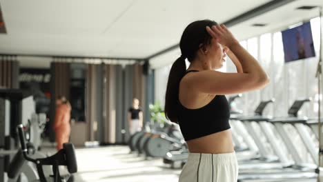 senior woman is engaging in vigorous jogginginplace exercise within comfort of her home. senior woman is engaging in vigorous jogging-in-place exercise within comfort of her home. mature woman dressed in comfortable athletic wear while smiling and enjoying workout